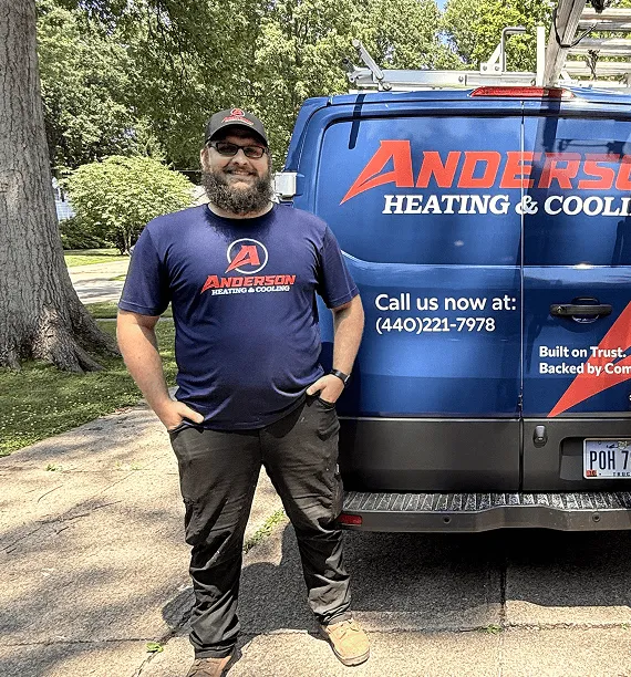 Anderson technician standing at the back of an Anderson Heating and Cooling van