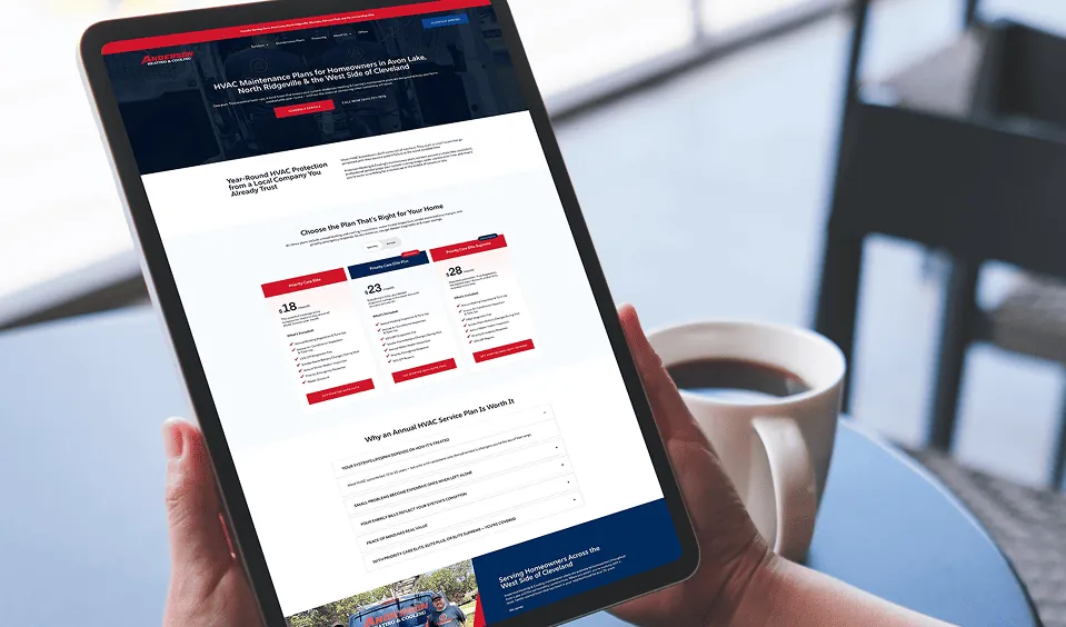Homeowner reviewing Anderson Heating & Cooling plan options on a tablet