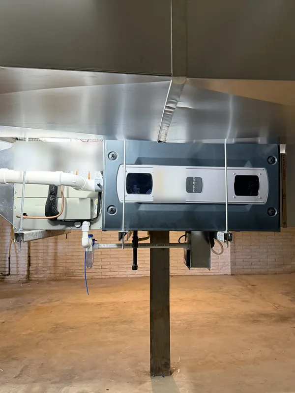 New furnace hung horizontally under new sheet-metal ductwork in Lagrange, OH